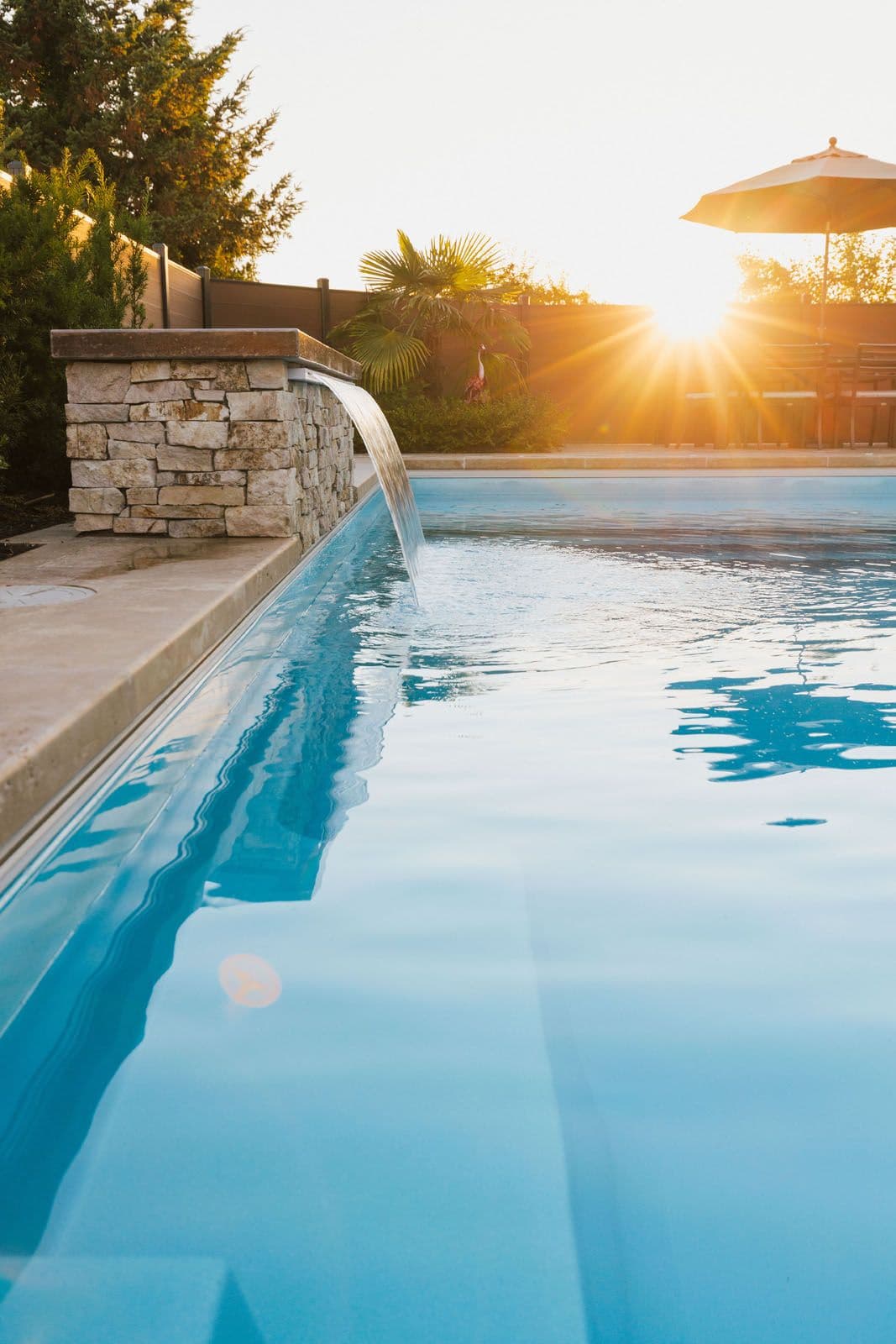 A calm and relaxing pool at sunset.